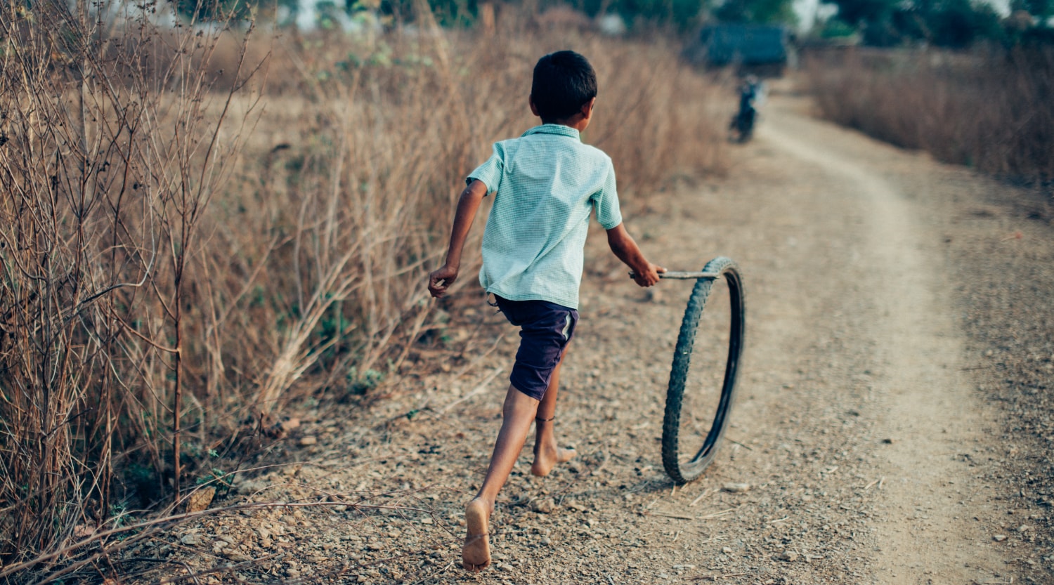 Indian child pushing trye for a campaign photography project